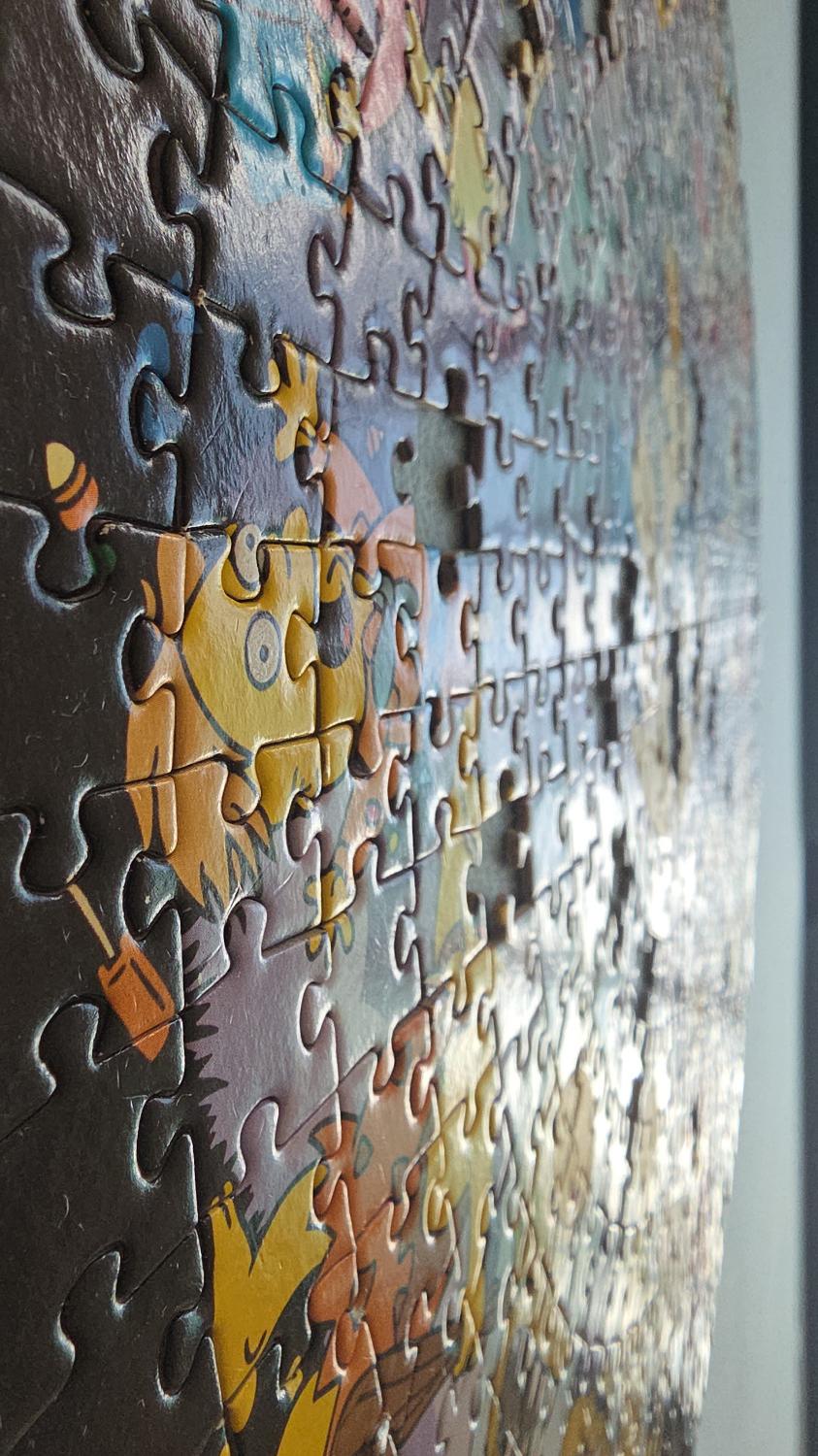 Close-up of interlocking jigsaw pieces on the Simpsons puzzle